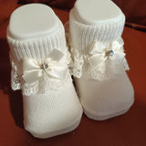 Babbucce col.panna con pizzo e fiocchetto con brillantino