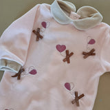 Tutina   rosa e beige con fiocchetti