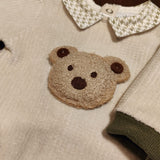 Tutina ciniglia luxury beige con teddy in rilievo e dettagli verde