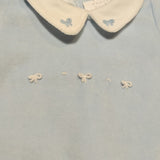 Tutina ciniglia celeste con fiocchetti a rilievo