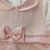 Tutina ciniglia luxury color pesca con corpino brillantinato e fiocco in satin