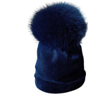 Cappellino di velluto blu con pon pon