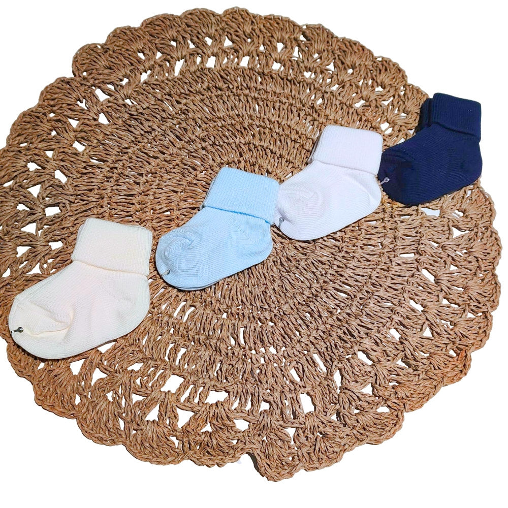 calzini per neonato in caldo cotone nei colori bianco panna celeste e blu